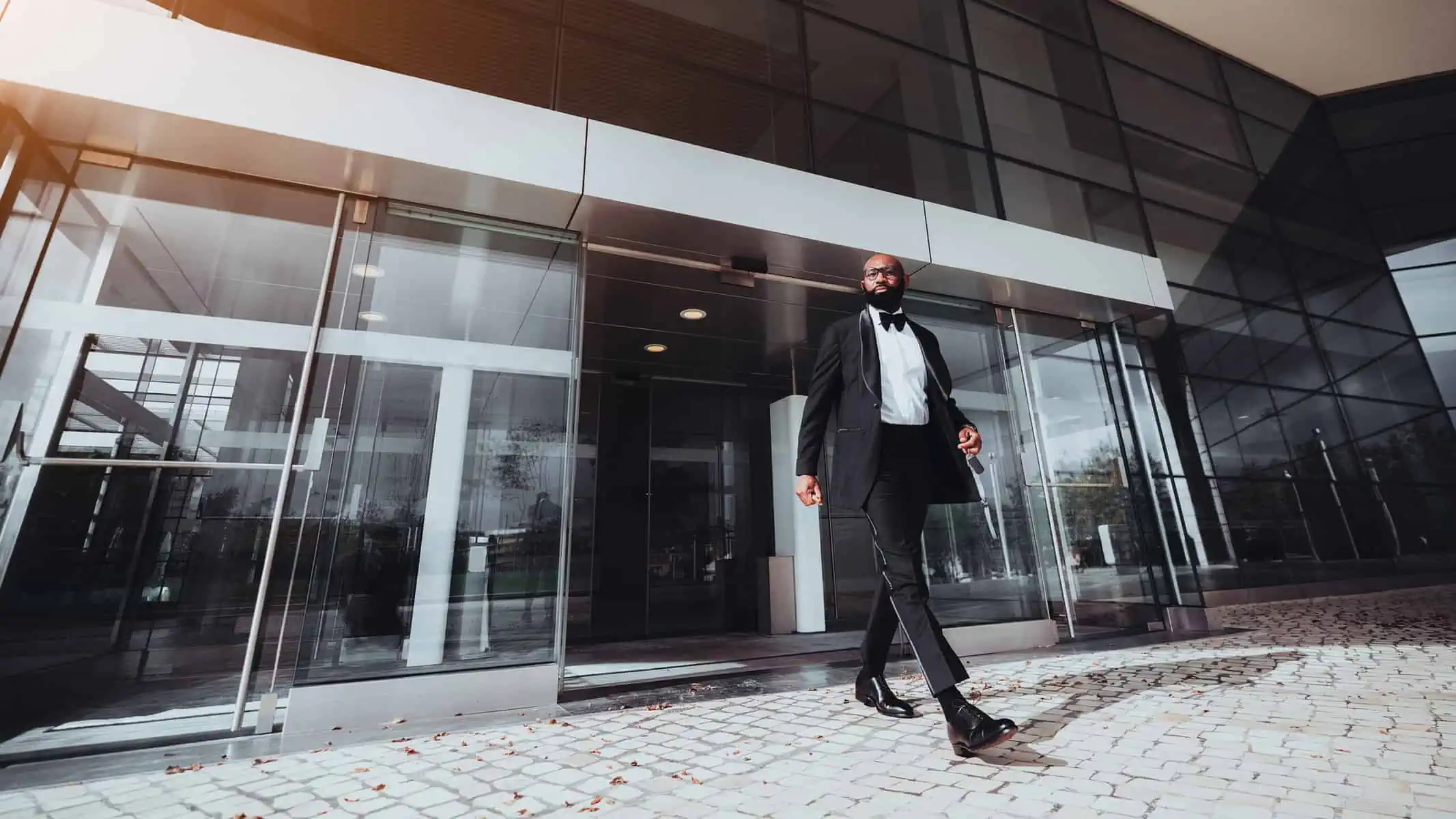 Man exiting through Automatic Sliding Doors installed by Access Hardware